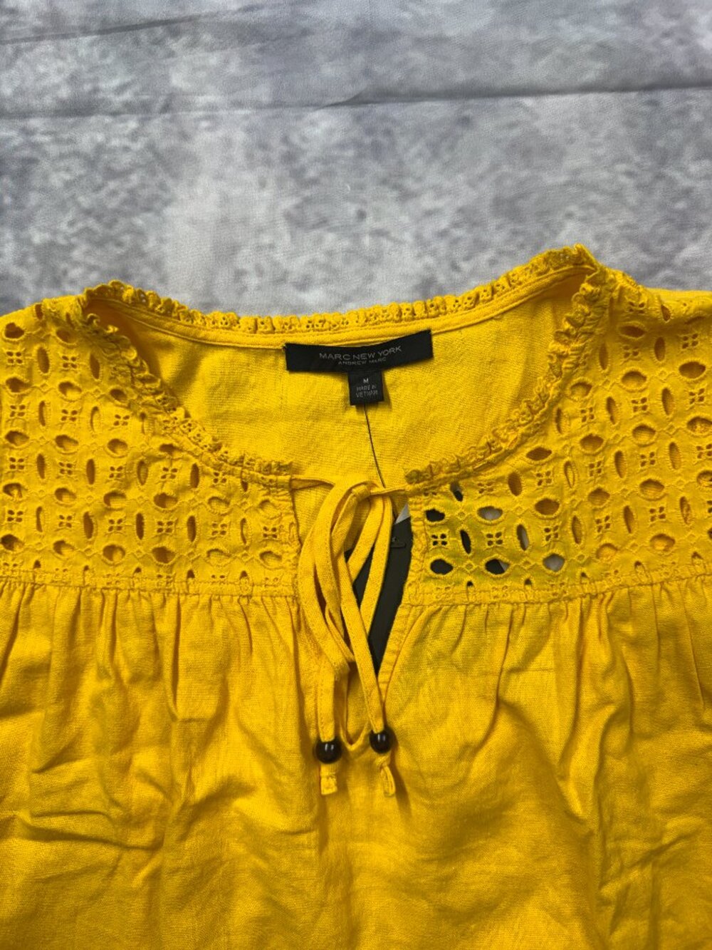 Marc New York yellow eyelet blouse features ruffled cap sleeves and a tassel tie - Picture 3 of 8